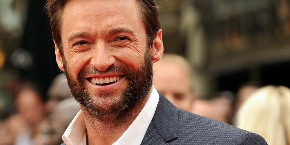 People queue on a sidewalk while physically distancing